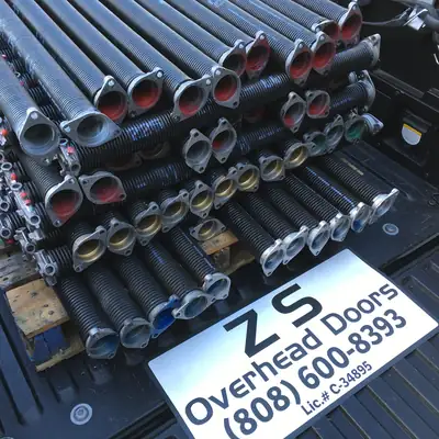 Pallet of new torsion springs in the ZS Overhead Doors truck