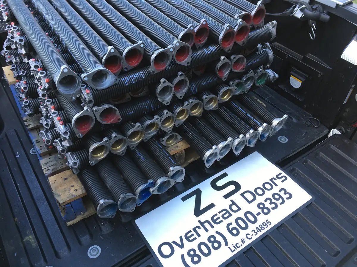 Pallet of new torsion springs in the back of the ZS Overhead Doors truck